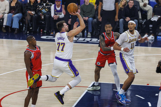 Luka Dončić attacking in a Los Angeles Lakers uniform