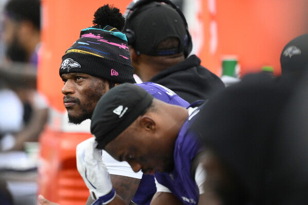 Lamar Jackson on the Baltimore Ravens sideline after injuring his ankle against Tennessee