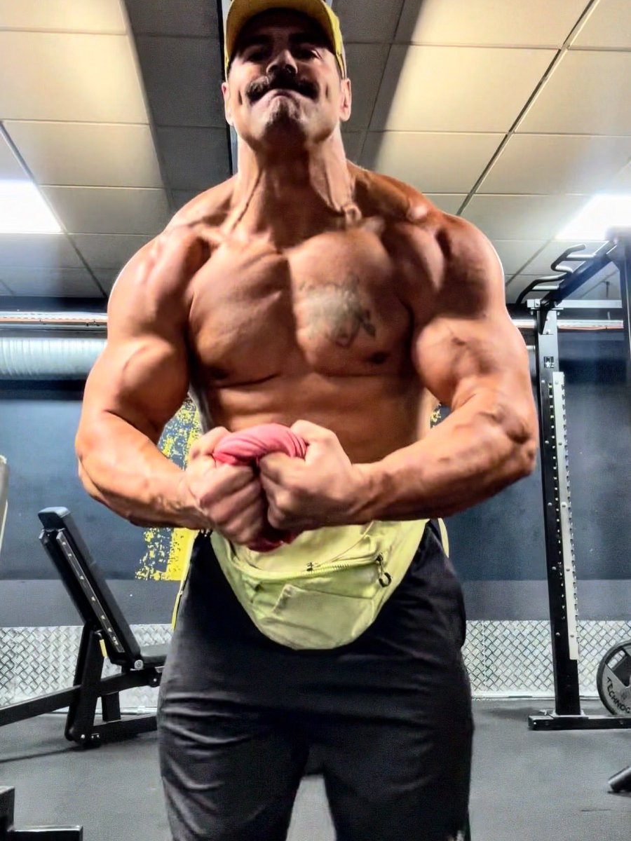 Eric Bugenhagen flexing a muscular physique in a gym