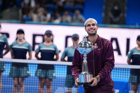 Carlos Alcaraz holding the Japan Open trophy in 2026