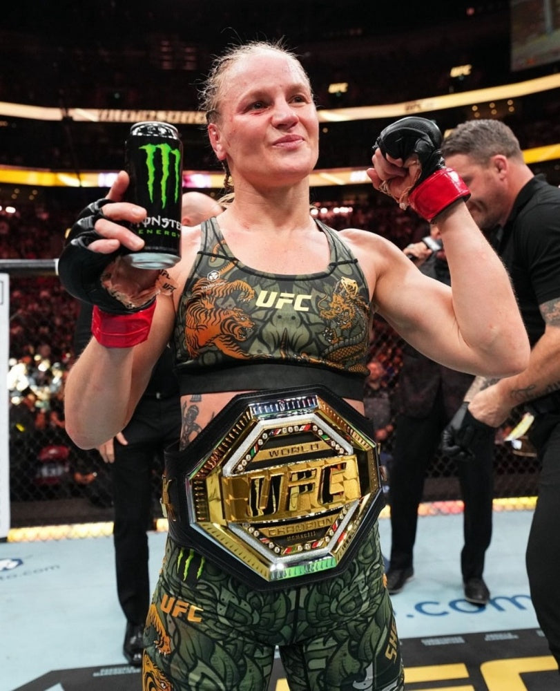 Valentina Shevchenko celebrating with the UFC women's flyweight championship