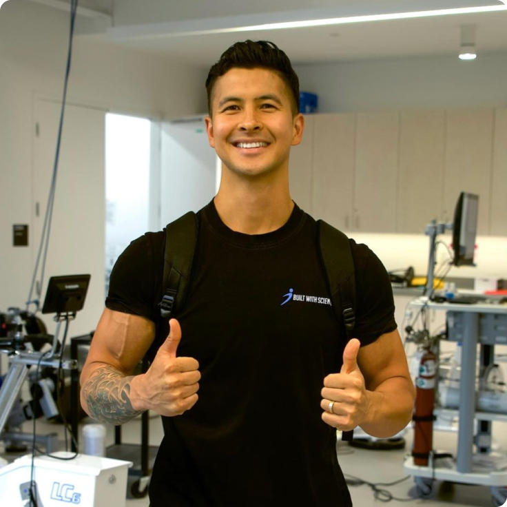 Jeremy Ethier smiling in a Built With Science shirt inside a fitness testing facility