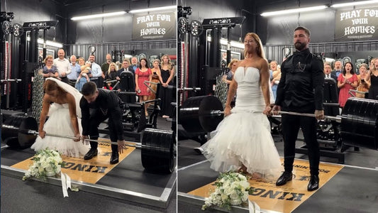 Bride and groom performing a 600-pound tandem deadlift in a gym wedding ceremony