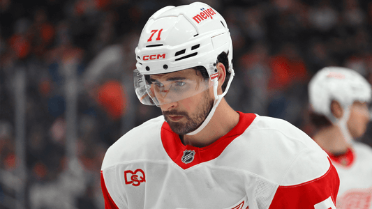 Dylan Larkin skating in a Detroit Red Wings white jersey in October 2026