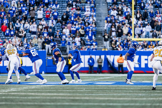 J.J. McCarthy wearing New York Giants blue number 18 in the October 18 2026 Saints game